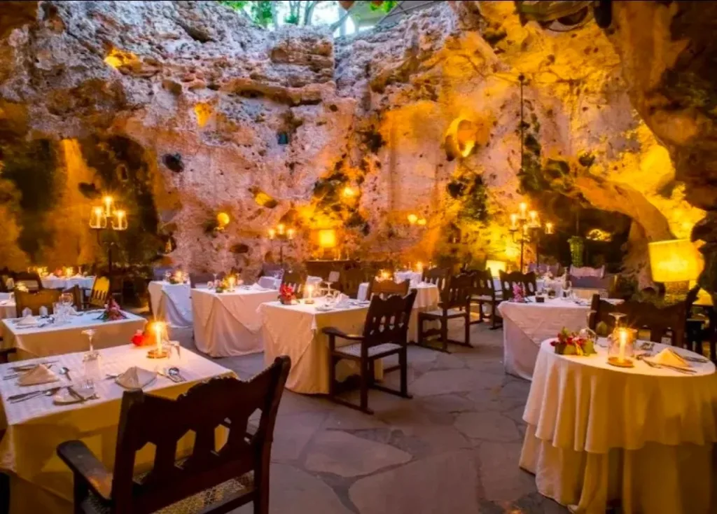 Candlelit dining setup inside a natural coral cave at Ali Barbour’s Cave Restaurant, one of the most unique places to eat in Diani Beach.
